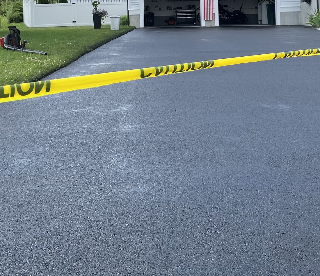 fresh asphalt in front of garage
